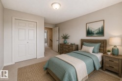 Neutral tone wall paint, textured ceiling, and flush mount lighting fixture - 