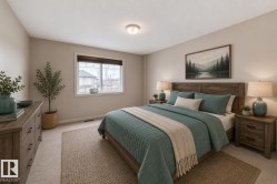 Bedroom featuring a wood-finish bed frame, coordinating headboard, and wood-finish nightstands - 