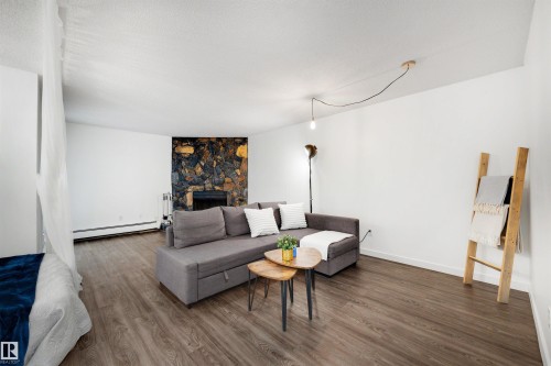 103 10138 116 Street, Edmonton, AB - Indoor Photo Showing Living Room With Fireplace