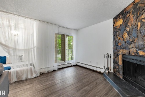 103 10138 116 Street, Edmonton, AB - Indoor With Fireplace