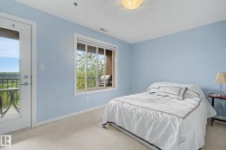 Room featuring light blue walls and carpeting - 