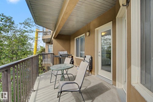 Private balcony featuring a concrete surface, dark metal railings, and a solid exterior wall - 303 530 Hooke Road, Edmonton, AB - Outdoor With Exterior