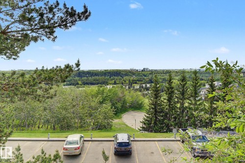 Expansive natural landscape with dense tree coverage and distant urban skyline - 303 530 Hooke Road, Edmonton, AB - Outdoor With View