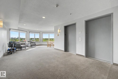 Elevator lobby featuring dual elevators, recessed lighting, and a carpeted floor - 303 530 Hooke Road, Edmonton, AB - Indoor