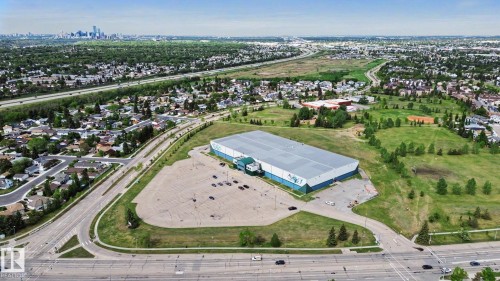 Large commercial structure with a light-colored roof and green accents - 303 530 Hooke Road, Edmonton, AB - Outdoor With View