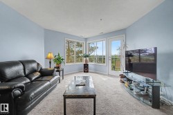Light blue walls complement the light-toned carpet flooring - 
