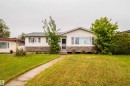 Ranch-style residence featuring white siding and a stone facade - 8512 142A Avenue, Edmonton, AB 
