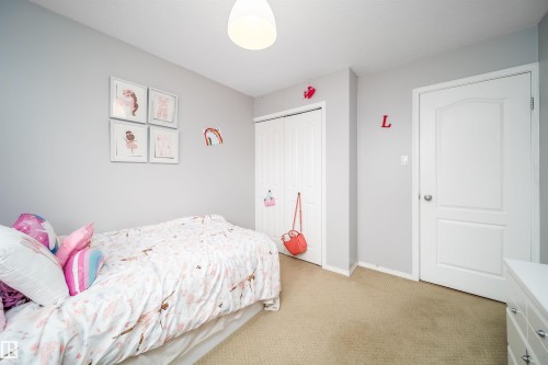 Neutral painted walls with a textured carpet floor - 8512 142A Avenue, Edmonton, AB 