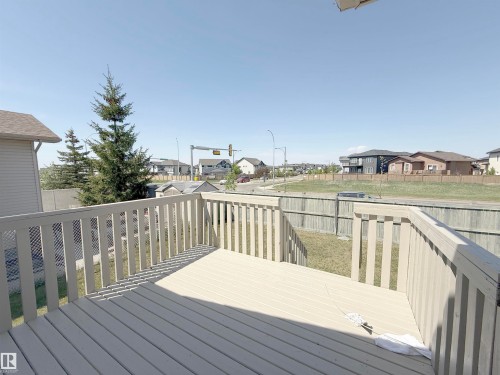 Spacious outdoor deck with light-toned wood-finish flooring and matching railings - 6144 166 Avenue, Edmonton, AB 