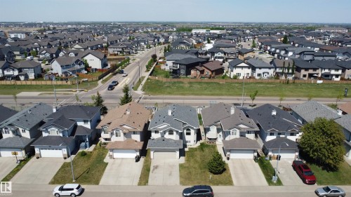 Residential neighborhood featuring diverse architectural styles and paved roadways - 6144 166 Avenue, Edmonton, AB 