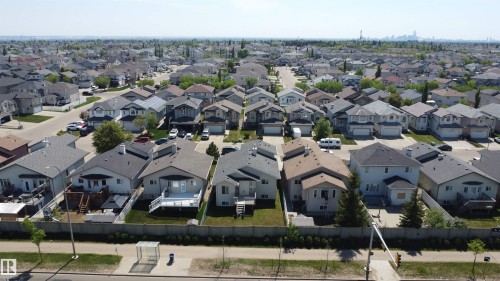 Aerial perspective showcasing a residential area with single-family homes, each featuring individual yards and varying architectural styles - 6144 166 Avenue, Edmonton, AB 