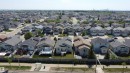 Aerial perspective showcasing a residential area with single-family homes, each featuring individual yards and varying architectural styles - 6144 166 Avenue, Edmonton, AB 