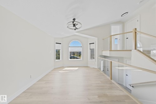 Bright, open interior space featuring light wood-finish flooring - 6144 166 Avenue, Edmonton, AB 
