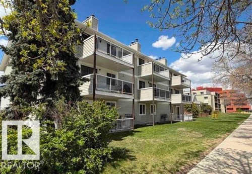 Multi-level building exterior featuring light-colored siding and a series of private balconies - 304 10604 110 Avenue, Edmonton, AB 