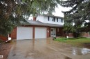 Traditional two-story residence featuring a brick facade and white siding - 68 Marlboro Road, Edmonton, AB 