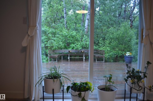 Sliding glass doors opening to an outdoor deck - 68 Marlboro Road, Edmonton, AB 