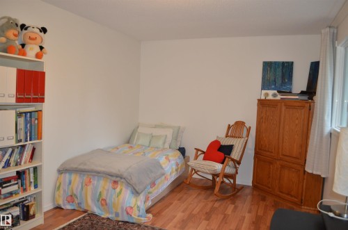 Hardwood-finish flooring enhancing a room with white walls and a white ceiling - 68 Marlboro Road, Edmonton, AB 