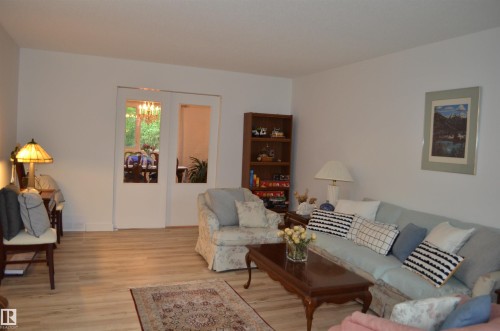 Light wood-finish flooring complements the neutral wall tones - 68 Marlboro Road, Edmonton, AB 