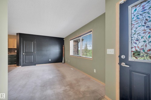 Entryway featuring a decorative stained-glass panel door - 40 604 62 Street, Edmonton, AB 