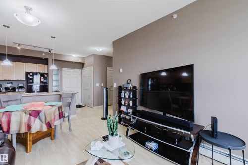 Bright living space featuring light wood-finish flooring - 1-405 4245 139 Avenue, Edmonton, AB 