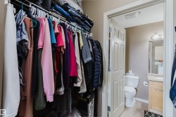 Walk-in closet featuring built-in wire shelving - 