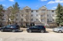 Multi-story condominium building featuring a light-colored exterior and multiple balconies - 320 245 Edwards Drive, Edmonton, AB 