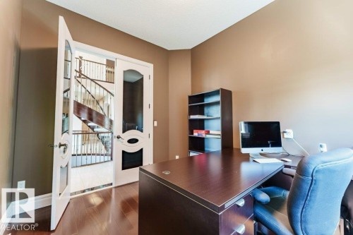 Private office space featuring wood-finish flooring and a neutral color palette - 328 52327 Range Rd 233, Rural Strathcona County, AB 