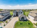 Modern architecture with contrasting dark gray and white siding - 328 52327 Range Rd 233, Rural Strathcona County, AB 