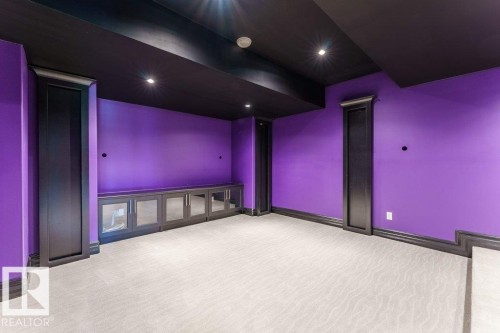 Room featuring violet walls, a black ceiling, and recessed lighting - 328 52327 Range Rd 233, Rural Strathcona County, AB 