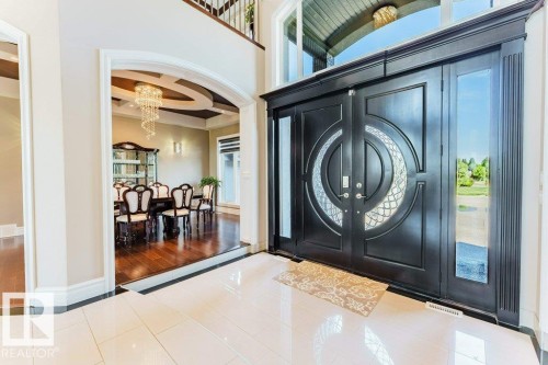 Grand double entry doors with decorative glass inserts and sidelights - 328 52327 Range Rd 233, Rural Strathcona County, AB 