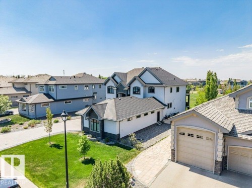 Modern architectural design featuring varied rooflines and a neutral color palette - 328 52327 Range Rd 233, Rural Strathcona County, AB 