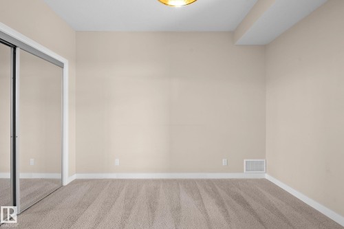 Neutral-toned walls complement plush carpeting - 309 625 Leger Way, Edmonton, AB 