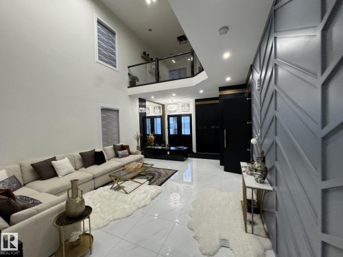 Living area featuring soaring ceilings and contemporary finishes - 2123 18 Avenue, Edmonton, AB 