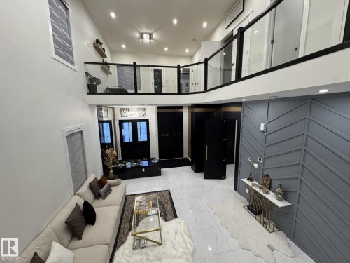 Two-story foyer featuring high ceilings and modern tile flooring - 2123 18 Avenue, Edmonton, AB 