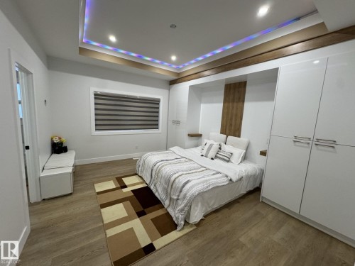 Recessed ceiling with integrated lighting and wood-finish accent beams - 2123 18 Avenue, Edmonton, AB 
