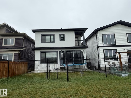Two-story property with white stucco siding and contrasting black trim details - 2123 18 Avenue, Edmonton, AB 