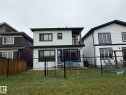 Two-story property with white stucco siding and contrasting black trim details - 2123 18 Avenue, Edmonton, AB 