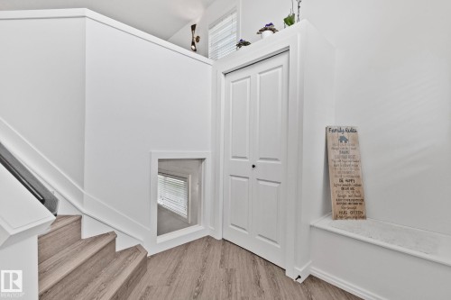 Staircase with wood-finish treads and white risers - 1 Hunt Court, St. Albert, AB 