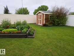 Planter boxes are part of property, but I Virtually staged to show the potential of a garden in bloom. - 