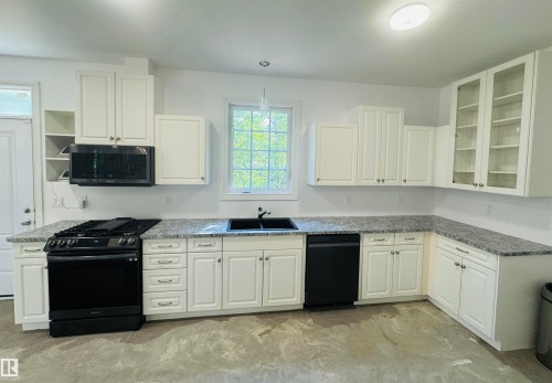 553 11207 Twp R 564, Rural St. Paul County, AB - Indoor Photo Showing Kitchen With Double Sink