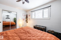 Bedroom with a ceiling fan and a closet - 