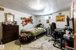 Basement bedroom featuring an office area - 