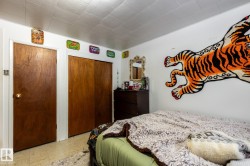 Basement bedroom with a closet and light flooring - 