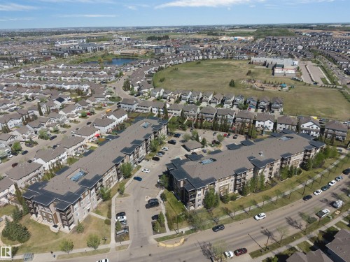 Contemporary multi-story apartment buildings featuring balconies and surface parking - 320 534 Watt Boulevard, Edmonton, AB - Outdoor With View