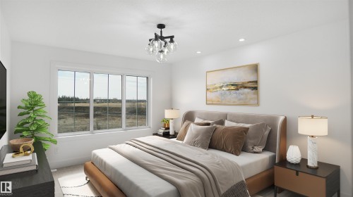 Bright interior with a triple-pane window, flush-mounted ceiling light fixture, recessed lighting, and light-toned wall finishes - 803 30 Avenue, Edmonton, AB 