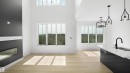 Open-concept living space featuring high ceilings, light wood-finish flooring, and expansive windows - 803 30 Avenue, Edmonton, AB 
