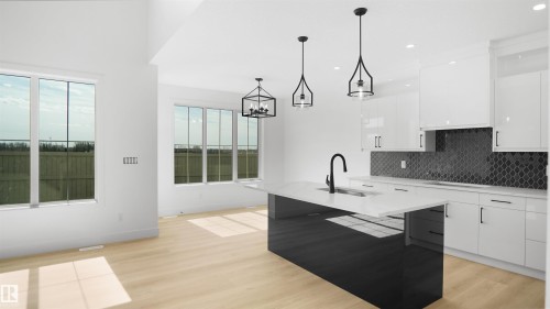 Open-concept kitchen and dining area featuring a dark kitchen island with a white countertop, light wood-finish flooring, white cabinetry, and a dark arabesque tile backsplash - 803 30 Avenue, Edmonton, AB 