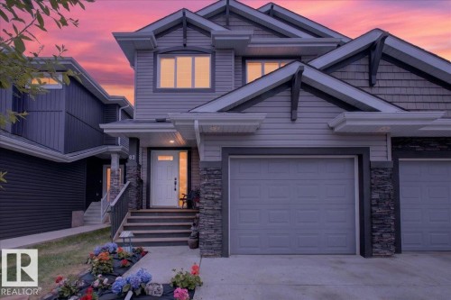 Multi-level facade with horizontal siding and shingle accents - 62 Durrand Bend, Fort Saskatchewan, AB 