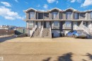 Contemporary townhome exterior featuring a stucco finish and contrasting white trim - 8 15128 22 Street, Edmonton, AB 