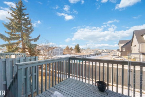 Spacious outdoor deck with painted wood railing - 8 15128 22 Street, Edmonton, AB 